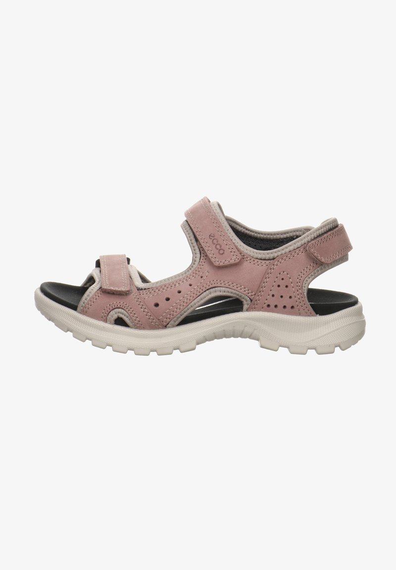 Pink leather sandal with adjustable straps, perforated accents, cushioned sole, and textured rubber outsole for grip.