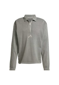 Grå langærmet pullover med halv lynlås foran, ribbet krave og diskrete sidestropper; har et lille tonalt logo på brystet.