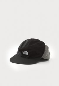 Svart caps med et mykt grått fleecefôr, med en frontskygge og broderte logo av The North Face på siden.