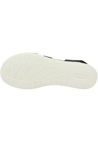 Black sandal base with a textured, white rubber sole. Features a smooth, flexible upper and a patterned footbed for comfort.