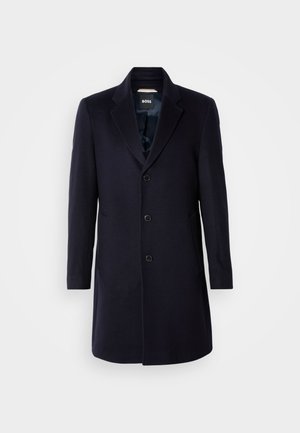 Marineblauer Wollmantel mit einem einreihigen Design, zwei Vorderaschen, Reverskragen und fünf schwarzen Knöpfen, ausgestattet mit einem glatten Satin-Innenfutter.