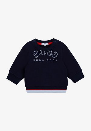 Sweatshirt bébé bleu marine à manches longues, avec "BOSS HUGO BOSS" brodé sur la poitrine, boutons pression au niveau de l'encolure, et détail de bordure rouge et blanche.