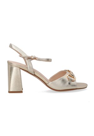 Gold metallic heeled sandal with an ankle strap, open toe, block heel, and front hardware detail. Smooth texture with a glossy finish.