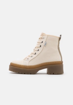 Enkellaarsjes met plateauzool - off-white