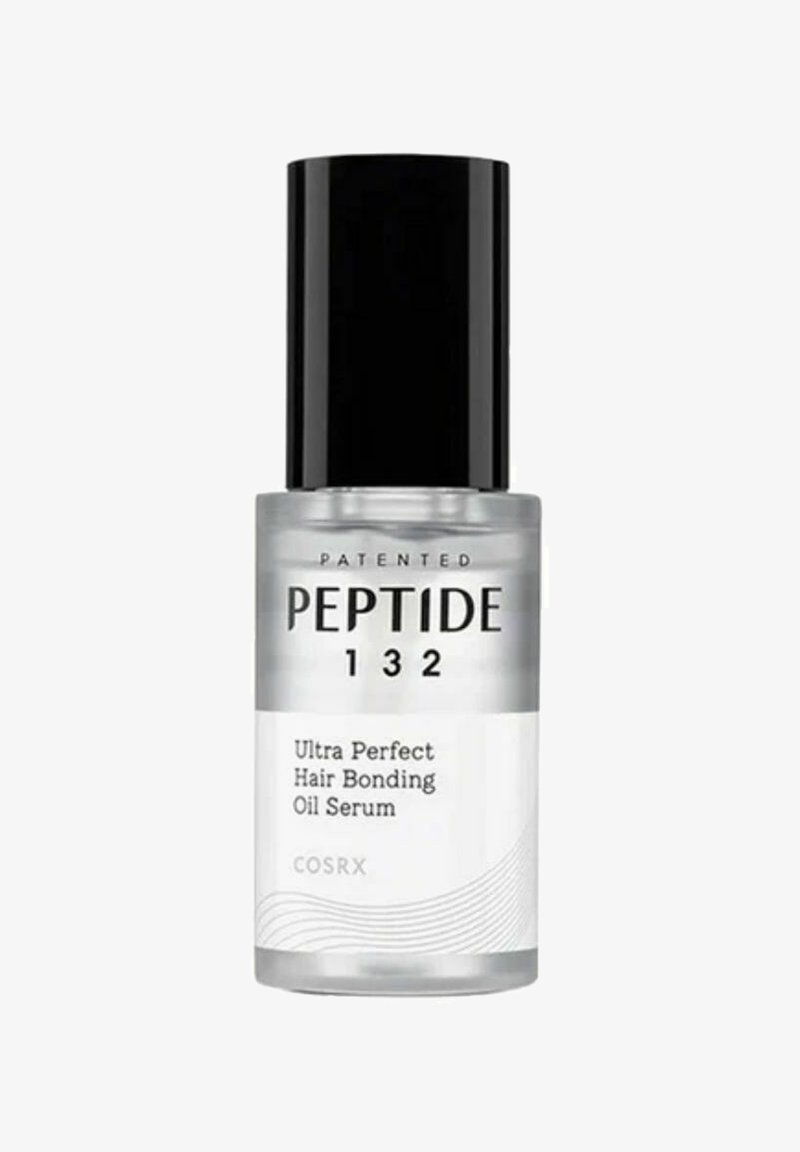 Flacon transparent de COSRX Peptide 132 Ultra Perfect Hair Bonding Oil Serum avec bouchon noir et étiquette blanche affichant le nom et les détails du produit.