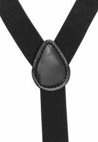 Bretelle nere regolabili con cinturini in tessuto testurizzato e connettore in pelle con cuciture a contrasto all'intersezione.
