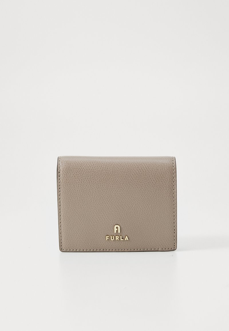 Beige leather wallet with a textured finish, featuring a gold logo at the bottom front. Compact, rectangular shape with clean edges.