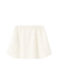 Jupe en dentelle blanche avec une taille élastique. Forme légèrement évasée, motif texturé et intérieur lisse. L'ourlet remonte sur les côtés.