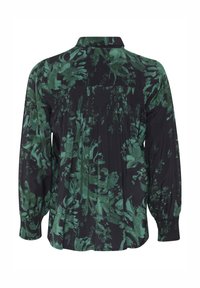 Black blouse with green floral pattern, button-down collar, smocking detail at the back, and gathered long sleeves. Soft fabric texture.