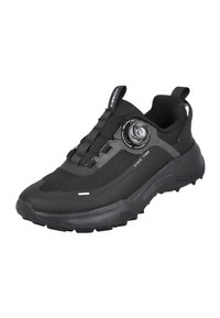 Zapato deportivo negro con parte superior de malla, puntera redondeada y suela texturizada. Incluye un dial circular para ajustar el ajuste y una marca mínima.