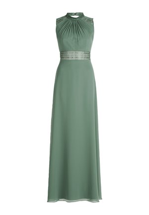 Mouwloze groene jurk met een gesculpteerde buste, versierde halslijn en decoratieve band op de taille. Glad, soepel materiaal. Tot op de vloer.