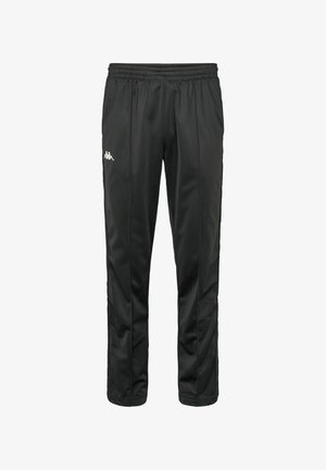 Pantalons de jogging noirs en matériau synthétique lisse, avec une taille élastique, des bandes latérales et un petit logo blanc sur la cuisse gauche.