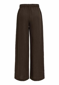 Pantalon large marron avec taille élastique en tissu léger texturé.