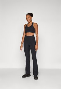 Champion TRAINING FLARE LEGGINGS INTERLOCK - Leggings - black