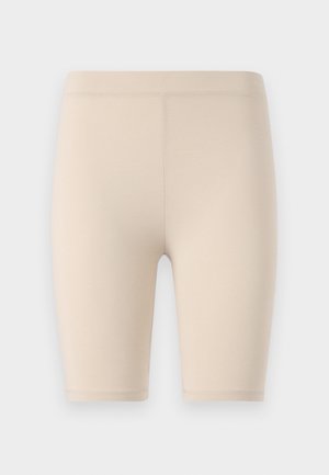Beige fietsbroekjes van rekbare stof. Midden-dij lengte met een gladde tailleband. Geen zichtbare patronen of accenten.