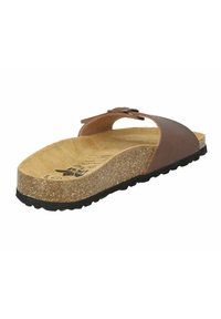 Brown leather slide sandal with cork footbed, textured sole, and adjustable strap. Rounded shape, minimalist design, and flat heel.