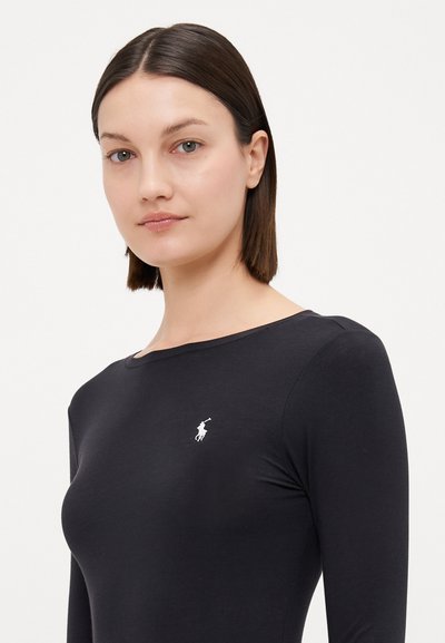 Black long-sleeve top with a crew neckline, made of smooth material, featuring a small white logo on the left chest.