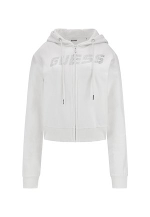 Witte cropped hoodie gemaakt van zacht materiaal, met een rits aan de voorkant, een capuchon met trekkoord en een rhinestone "GUESS" logo op de borst.