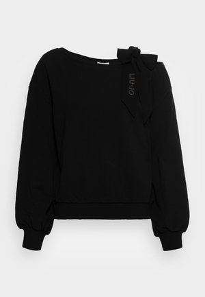 Sweatshirt noir en tissu doux, doté d'un large col, de manches bouffantes, d'un ourlet resserré et d'un détail en forme de nœud sur l'épaule gauche.
