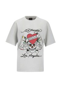 Light gray cotton t-shirt featuring a colorful graphic of a skull with a heart, surrounded by a banner and floral accents.