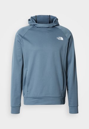 Ανοιχτό μπλε φούτερ με κουκούλα τύπου κασκόλ, μανίκια ράγκλαν, υφασμάτινη υφή και το λογότυπο The North Face σε λευκό στην αριστερή πλευρά του στήθους.