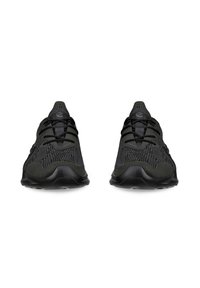 Black athletic shoes with a textured knit upper and smooth rubber sole, featuring lace-up closure and a streamlined design.