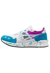 White athletic shoe featuring turquoise and purple accents, mesh and synthetic upper, textured sole, and unique blue speckled detailing.