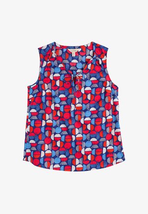 Bezramenný modrý top s geometrickým potiskem červených, bílých a světle modrých kruhů a obdélníků, s detailem vázání u výstřihu.