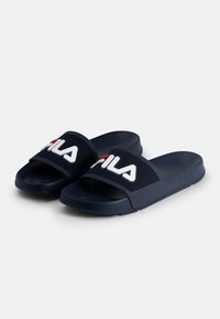 Navy blue slide sandals made of durable material, featuring a mesh strap with white "FILA" logo and red accent. Flat sole design.