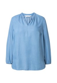 Blusa in denim azzurro chiaro a maniche lunghe con scollatura a V, dettagli arricciati nella scollatura e polsini elasticizzati. Texture liscia, design casual.