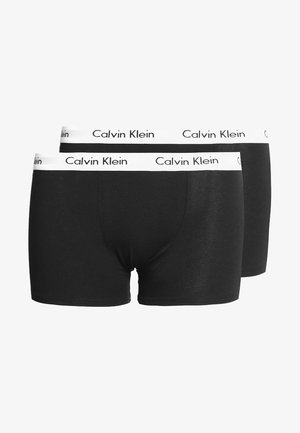 Boxer briefs pretos em algodão com uma faixa branca apresentando "Calvin Klein" impresso em preto. O estilo é ajustado, com uma textura suave.