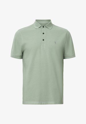 Koszulka polo w jasnozielonym kolorze z bawełny, z klasycznym kołnierzykiem, trzema czarnymi guzikami i małym szarym logo na lewej piersi. Krótkie rękawy.