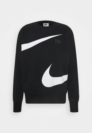 Schwarzer Nike-Sweatshirt mit großen weißen Swoosh-Logos auf der Vorderseite und "TM"-Text auf der oberen Brustpartie, mit gerippten Bündchen und Saum.