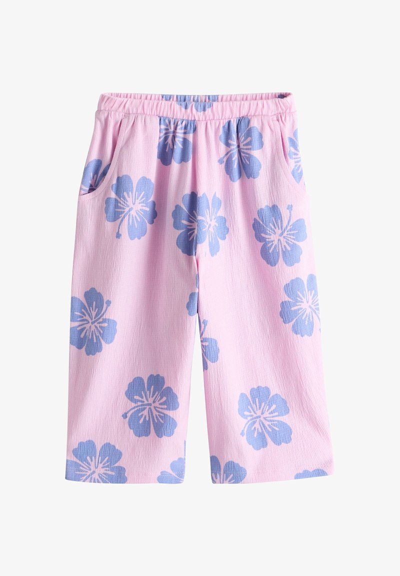 Rozā bērnu bikses ar zilu hibiska ziedu apdruku, elastīgu jostasvietu un sānu kabatām.