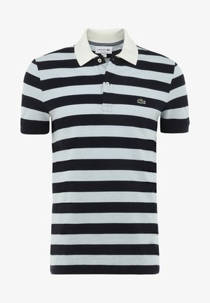 Raidallinen polopaita laivastonsinisessä ja vaaleansinisessä puuvillassa, jossa on kermaisen värinen kaulus, kaksi nappia ja pieni vihreä logo vasemmassa rinnassa.