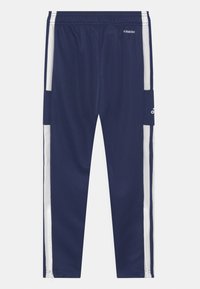 Marine sportieve broek van gladde stof, met witte zijstrepen, een elastische tailleband en ritszakken aan de zijkanten.