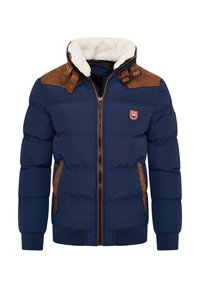 Navy-blaues Puffer-Jackett mit braunen Kunstlederakzenten, cremefarbenem Fleece-Kragen, Reißverschluss, gerippten Bündchen und einem Logo-Patch auf der Brust.