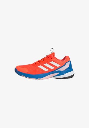 Red athletic shoe with white stripes, designed with mesh upper, padded collar, blue accents, a textured sole, and pull tab at heel.