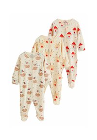 Tre sæt babypyjamas i cremefarve med forskellige julemønstre: rensdyr, kager og juleslips, med trykknapslukninger og ribbet tekstur.