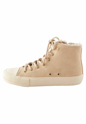 High-top beige sneaker with beige rubber sole, laces, and soft, fluffy lining around the ankle on a white background.
