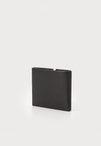 Portefeuille en cuir noir avec une finition texturée, design pliable, forme compacte, mettant en avant un accent de couleur subtil sur le bord.