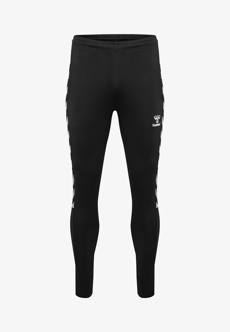 Black athletic leggings with white chevron patterns along the sides and a small white Hummel logo on the upper right thigh.