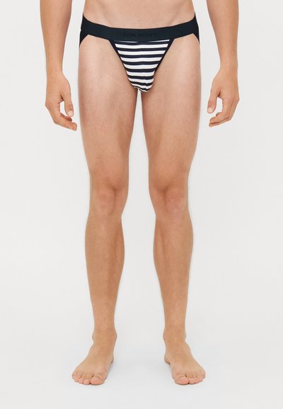Gestreifte Herren-Bikiniunterwäsche mit einem schwarzen elastischen Bund. Verziert mit horizontalen schwarz-weißen Streifen. Entworfen für eine enganliegende Passform.
