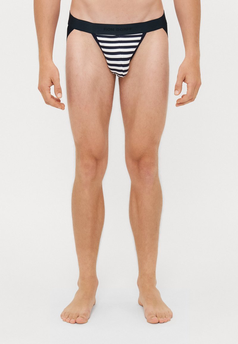 Gestreifte Herren-Bikiniunterwäsche mit einem schwarzen elastischen Bund. Verziert mit horizontalen schwarz-weißen Streifen. Entworfen für eine enganliegende Passform.