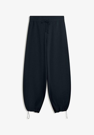 Black sweatpants made of soft fabric, featuring an elastic waistband with drawstring, tapered ankles, and side seam pockets.