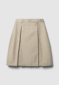 Jupe plissée beige avec une silhouette droite, fabriquée en tissu lisse. Dotée de passants de ceinture et d'un ourlet qui tombe au-dessus du genou.