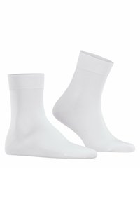 Calze bianche in cotone con un polsino a costine, caratterizzate da una consistenza liscia e altezza standard fino al polpaccio, mostrate in un'abbondanza di coppie.