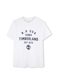 Camiseta de algodón blanca con texto impreso en azul marino y un logotipo. Mangas cortas y cuello redondo con dobladillo recto.