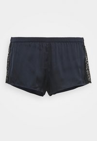 Marine satengshorts med en glatt tekstur, med svarte blondeaksenter på sidene. Elastisk liv for komfort, skreddersydd passform.