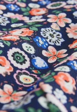 Navy fabric with textured surface featuring multicolored floral patterns in orange, blue, white, green, and pink scattered across.